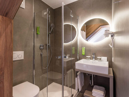 Bathroom with shower in the Panorama Double Room of Hotel Zach in Innsbruck